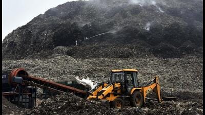 Fire services personnel dousing a fire at Bhandwari landfill on Gurugram - Faridabad border in 2021. (HT Archive) Fire services personnel dousing a fire at Bhandwari landfill on Gurugram - Faridabad border in 2021. (HT Archive)