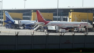 An IndiGo aircraft and an Air India aircraft on the tarmac at Indira Gandhi International Airport in New Delhi. (Bloomberg) An IndiGo aircraft and an Air India aircraft on the tarmac at Indira Gandhi International Airport in New Delhi. (Bloomberg)