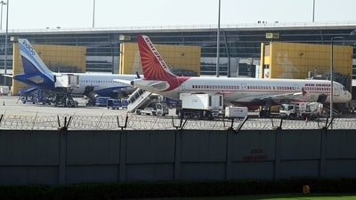 An IndiGo aircraft and an Air India aircraft on the tarmac at Indira Gandhi International Airport in New Delhi. (Bloomberg) (Bloomberg) An IndiGo aircraft and an Air India aircraft on the tarmac at Indira Gandhi International Airport in New Delhi. (Bloomberg) (Bloomberg)