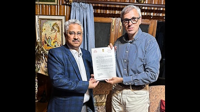 Jammu and Kashmir, Oct 14 (ANI): JKNC Vice President Omar Abdullah receives the letter from Lt Governor Manoj Sinha, inviting him to form the next government in J&K, on Monday. (ANI Photo) (Omar Abdullah- X) Jammu and Kashmir, Oct 14 (ANI): JKNC Vice President Omar Abdullah receives the letter from Lt Governor Manoj Sinha, inviting him to form the next government in J&K, on Monday. (ANI Photo) (Omar Abdullah- X)