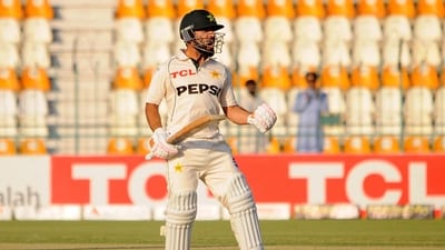 Pakistan's Kamran Ghulam celebrates after reaching his century on his Test debut. (REUTERS)