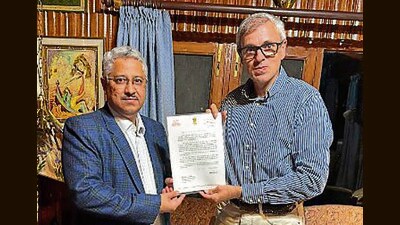 L-G’s principal secretary handing over a letter inviting CM-elect Omar Abdullah to form the government. (Source: X) L-G’s principal secretary handing over a letter inviting CM-elect Omar Abdullah to form the government. (Source: X)