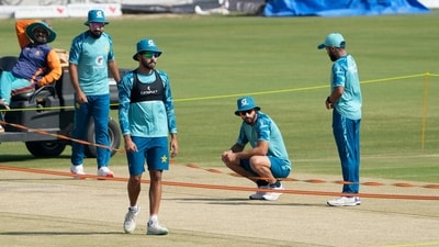 Pakistan's Saud Shakeel, right, with teammates examine pitch preparing for second test cricket match against England after a practice session, in Multan (AP) Pakistan's Saud Shakeel, right, with teammates examine pitch preparing for second test cricket match against England after a practice session, in Multan (AP)