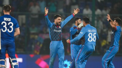 Rashid Khan celebrates with team-mates after Afghanistan beat England in a group match of 2023 World Cup in Delhi. (PTI Photo) Rashid Khan celebrates with team-mates after Afghanistan beat England in a group match of 2023 World Cup in Delhi. (PTI Photo)