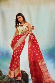 Outfit: Indeloom
She looks radiant in a red and gold Benarasi saree from Indeloom with a lotus motif blouse from Kalon Art Jewellery. Her look has been accented with bangles from Zeraki Jewels Outfit: Indeloom
She looks radiant in a red and gold Benarasi saree from Indeloom with a lotus motif blouse from Kalon Art Jewellery. Her look has been accented with bangles from Zeraki Jewels
