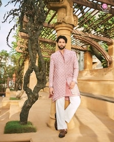 Outfit: Jigar & Nikita
Siddhant looks dapper in a pastel pink sherwani by Jigar & Nikita, paired with contrasting straight white pants. He completes the outfit with brown loafers (Sheldon Santos) Outfit: Jigar & Nikita
Siddhant looks dapper in a pastel pink sherwani by Jigar & Nikita, paired with contrasting straight white pants. He completes the outfit with brown loafers (Sheldon Santos)