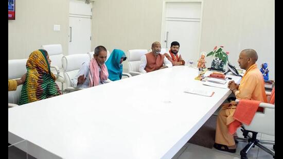 Chief minister Yogi Adityanath meets the family members of Ram Gopal Mishra, who died in Bahraich violence, in Lucknow on Tuesday. (ANI Photo)