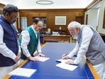 Prime Minister Narendra Modi renews his membership as the first active member of the Bharatiya Janata Party (BJP) (ANI Photo)

