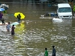 People wade through a flooded street amid heavy rainfall in Chennai on October 15, 2024. (Photo by R.Satish BABU / AFP) People wade through a flooded street amid heavy rainfall in Chennai on October 15, 2024. (Photo by R.Satish BABU / AFP)