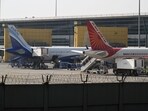 An IndiGo aircraft, a unit of InterGlobe Aviation Ltd., left, and an Air India Ltd. aircraft on the tarmac at Indira Gandhi International Airport in New Delhi. An IndiGo aircraft, a unit of InterGlobe Aviation Ltd., left, and an Air India Ltd. aircraft on the tarmac at Indira Gandhi International Airport in New Delhi.
