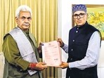 Omar Abdullah hands letters of support to J&K LG Manoj Sinha at Raj Bhawan in Srinagar on Friday. (PTI) Omar Abdullah hands letters of support to J&K LG Manoj Sinha at Raj Bhawan in Srinagar on Friday. (PTI)