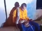 A giant python was filmed draped across a drunk man in Andhra Pradesh A giant python was filmed draped across a drunk man in Andhra Pradesh