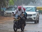 People commute amid rains due to Spawn cyclone in Bengaluru on Tuesday. People commute amid rains due to Spawn cyclone in Bengaluru on Tuesday.