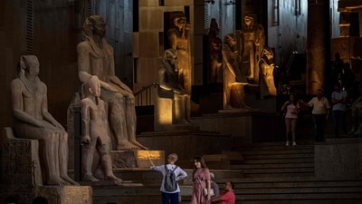 A picture shows ancient Egyptian colossal statues along the Grand Staircase at the Grand Egyptian Museum in Giza during the trial operation of the Grand Egyptian Museum. Grand Egyptian Museum’s long-awaited trial run starts: Here’s why you need to visit now (Photo by Khaled DESOUKI / AFP) A picture shows ancient Egyptian colossal statues along the Grand Staircase at the Grand Egyptian Museum in Giza during the trial operation of the Grand Egyptian Museum. Grand Egyptian Museum’s long-awaited trial run starts: Here’s why you need to visit now (Photo by Khaled DESOUKI / AFP)