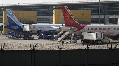 An IndiGo aircraft, a unit of InterGlobe Aviation Ltd., left, and an Air India Ltd. aircraft on the tarmac at Indira Gandhi International Airport in New Delhi. (Bloomberg file photo)