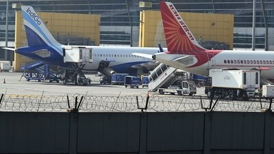 An IndiGo aircraft and an Air India plane on the tarmac at Indira Gandhi International Airport in New Delhi. (Photo for representational purpose only/Bloomberg) An IndiGo aircraft and an Air India plane on the tarmac at Indira Gandhi International Airport in New Delhi. (Photo for representational purpose only/Bloomberg)