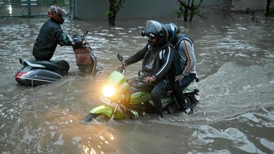 A Bengaluru man reveals his 'life and death' experience amid heavy rainfall (Representational image) (AFP) A Bengaluru man reveals his 'life and death' experience amid heavy rainfall (Representational image) (AFP)