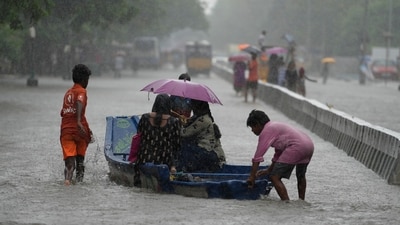 People use a boat on a flooded street to reach safer place during heavy rains in Chennai (AP Photo/Mahesh Kumar A.) (AP) People use a boat on a flooded street to reach safer place during heavy rains in Chennai (AP Photo/Mahesh Kumar A.) (AP)