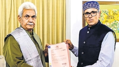 Omar Abdullah hands letters of support to J&K LG Manoj Sinha at Raj Bhawan in Srinagar on Friday. (PTI)