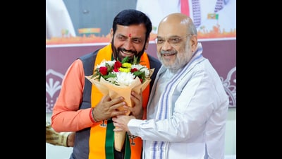 Union Home Minister Amit Shah felicitates Nayab Singh Saini after he was chosen as the leader of BJP legislature party, in Panchkula on Wednesday. (ANI)