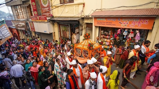 Devotees take part in a 'shobha yatra' ahead of Valmiki Jayanti in Shimla on October 15. (PTI) Devotees take part in a 'shobha yatra' ahead of Valmiki Jayanti in Shimla on October 15. (PTI)