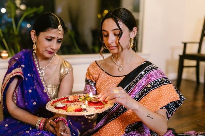 Women come together to listen to Vrat Katha. (Pexels) Women come together to listen to Vrat Katha. (Pexels)