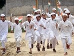Children celebrating with the tricolour in their hands after hoisting the tricolour at Jamia Usman Bin Affan Madrasa dasna on the occasion of Independence Day in Ghaziabad.