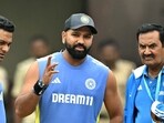 India's captain Rohit Sharma (C) inspects the field after the first day play of the first Test cricket match between India and New Zealand was called-off due to rain India's captain Rohit Sharma (C) inspects the field after the first day play of the first Test cricket match between India and New Zealand was called-off due to rain