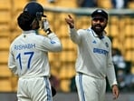 India's captain Rohit Sharma (R) gestures during the second day of the first Test cricket match between India and New Zealand at the M. Chinnaswamy Stadium in Bengaluru India's captain Rohit Sharma (R) gestures during the second day of the first Test cricket match between India and New Zealand at the M. Chinnaswamy Stadium in Bengaluru