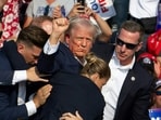 Donald Trump was hit in the ear in an apparent assassination attempt by a gunman at a campaign rally on Saturday, in a chaotic and shocking incident that will fuel fears of instability ahead of the 2024 US presidential election. (Photo by Rebecca DROKE / AFP)