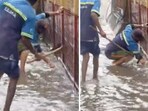 A video showing two civic workers on their hands and knees to clean out clogged drains near Bellandur. A video showing two civic workers on their hands and knees to clean out clogged drains near Bellandur.
