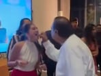 Radhika Merchant is seen cutting her cake and sharing it with the Ambani family.