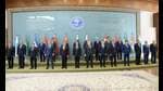 This handout photograph taken on October 16, 2024 and released by Pakistan's Press Information Department (PID) shows Pakistan's Prime Minister Shehbaz Sharif (C front) posing for a group picture with the heads of the delegate members during the Shanghai Cooperation Organisation (SCO) summit, in Islamabad. The SCO comprises China, India, Russia, Pakistan, Iran, Kazakhstan, Kyrgyzstan, Tajikistan, Uzbekistan and Belarus -- with 16 more countries affiliated as observers or 