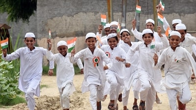 Children celebrating with the tricolour in their hands after hoisting the tricolour at Jamia Usman Bin Affan Madrasa dasna on the occasion of Independence Day in Ghaziabad. ((Photo by Sakib Ali /Hindustan Times))