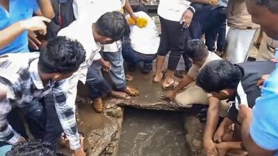 A 12-year-old boy fell into a drain amid rainfall in Haveri on Wednesday while he was returning from his tuition class. (PTI) A 12-year-old boy fell into a drain amid rainfall in Haveri on Wednesday while he was returning from his tuition class. (PTI)