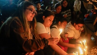 Fans light candles outside the hotel. Emergency workers confirmed the death of the British singer, who was reportedly found in the hotel's interior patio. (AP) Fans light candles outside the hotel. Emergency workers confirmed the death of the British singer, who was reportedly found in the hotel's interior patio. (AP)