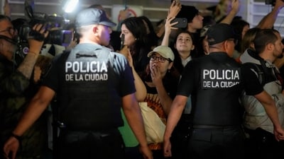 Police restrain fans gathering outside the hotel where singer Liam Payne was found dead. The hotel manager said he heard a loud noise at the back of the hotel, and when police arrived they found that a man had fallen over the balcony in his room, the statement said. (AP) Police restrain fans gathering outside the hotel where singer Liam Payne was found dead. The hotel manager said he heard a loud noise at the back of the hotel, and when police arrived they found that a man had fallen over the balcony in his room, the statement said. (AP)