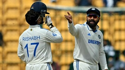 India's captain Rohit Sharma (R) gestures during the second day of the first Test cricket match between India and New Zealand at the M. Chinnaswamy Stadium in Bengaluru (AFP) India's captain Rohit Sharma (R) gestures during the second day of the first Test cricket match between India and New Zealand at the M. Chinnaswamy Stadium in Bengaluru (AFP)