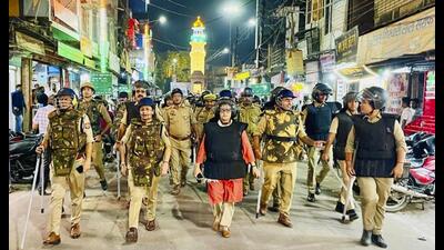 District magistrate Monika Rani and superintendent of police Vrinda Shukla conduct a route march to maintain peace in the violence-hit area of Maharajganj, in Bahraich, Thursday. (PTI Photo) District magistrate Monika Rani and superintendent of police Vrinda Shukla conduct a route march to maintain peace in the violence-hit area of Maharajganj, in Bahraich, Thursday. (PTI Photo)