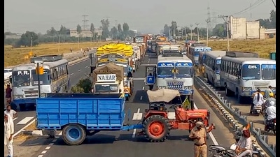 Farmers block the Dhareri Jatta toll plaza and stage a protest on Rajpura Road, Patiala, on Thursday. (PTI) Farmers block the Dhareri Jatta toll plaza and stage a protest on Rajpura Road, Patiala, on Thursday. (PTI)