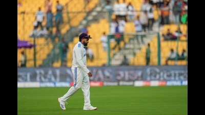 India’s captain Rohit Sharma walks towards the pavilion after the end of play on the second day of the first Test against New Zealand. (PTI) India’s captain Rohit Sharma walks towards the pavilion after the end of play on the second day of the first Test against New Zealand. (PTI)