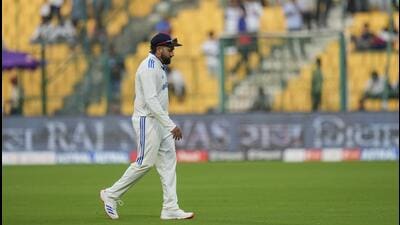 India’s captain Rohit Sharma walks towards the pavilion after the end of play on the second day of the first Test against New Zealand. (PTI) India’s captain Rohit Sharma walks towards the pavilion after the end of play on the second day of the first Test against New Zealand. (PTI)