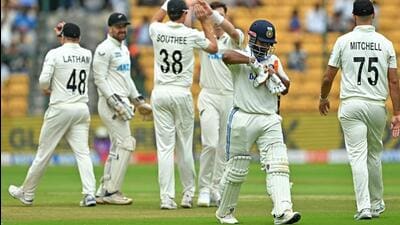 New Zealand players celebrate after the dismissal of India's Rishabh Pant during the second day of the first Test at the M. Chinnaswamy Stadium in Bengaluru. (AFP) New Zealand players celebrate after the dismissal of India's Rishabh Pant during the second day of the first Test at the M. Chinnaswamy Stadium in Bengaluru. (AFP)