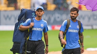 Virat Kohli and Yashasvi Jaiswal walk on the field during rains on the first day of the first test cricket match between India and New Zealand at M Chinnaswamy Stadium, in Bengaluru (PTI) Virat Kohli and Yashasvi Jaiswal walk on the field during rains on the first day of the first test cricket match between India and New Zealand at M Chinnaswamy Stadium, in Bengaluru (PTI)