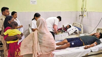 People being treated after the consumption of suspected spurious liquor, in Saran, (PTI Photo) (PTI) People being treated after the consumption of suspected spurious liquor, in Saran, (PTI Photo) (PTI)