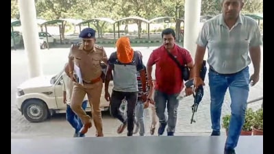Police personnel and others after arresting Sukha, alias Sukhbir Balbir Singh, a member of the Lawrence Bishnoi gang and an accused in an alleged plot to kill Bollywood actor Salman Khan. (PTI)