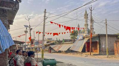 Police personnel keep a vigil at a deserted area of Maharajganj after a recent communal violence, in Bahraich district. (PTI photo)
