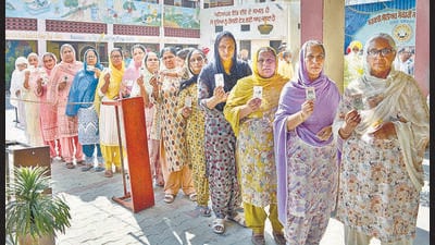 Voters at a pooling booth in Tharike village in Ludhiana on Tuesday. (HT Photo) Voters at a pooling booth in Tharike village in Ludhiana on Tuesday. (HT Photo)