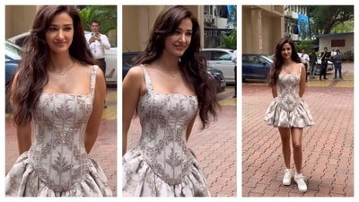 Disha Patani looked doll-like in a strapless mini corset dress. The bodice had detailed embroidery, while the puffy, pleated skirt added to the cutesy charm. She pulled off white sneakers with the dress, making a trendy statement of pairing sporty aesthetic shoes with hyper-feminine outfits.&nbsp; (Instagram/@varindertchawla)