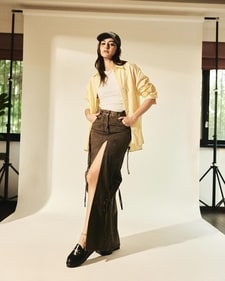 Ananya Panday dons a lime yellow and white striped loose shirt, a white crop top and a faded black cargo skirt (Photo: Instagram) Ananya Panday dons a lime yellow and white striped loose shirt, a white crop top and a faded black cargo skirt (Photo: Instagram)